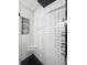 Modern bathroom with subway tile, a corner seat, and a shower niche with black and white patterned tile at 116 Lyle Rd, Goose Creek, SC 29445