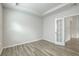 Bright bedroom featuring wood-look flooring, recessed lighting, and an open door at 117 Oyster Tide Ave, Summerville, SC 29485