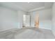 Bright bedroom featuring neutral carpeting and ensuite bathroom access at 117 Oyster Tide Ave, Summerville, SC 29485