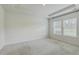 Spacious bedroom featuring carpet flooring, recessed lighting, and natural light from the large windows at 117 Oyster Tide Ave, Summerville, SC 29485