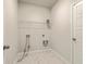 Functional laundry room with tiled floor, a storage shelf, and utility connections ready for appliances at 117 Oyster Tide Ave, Summerville, SC 29485