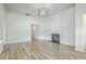 Spacious living room featuring fireplace, hardwood floors, modern lighting, and neutral color palette at 117 Oyster Tide Ave, Summerville, SC 29485