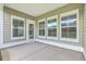 Covered patio featuring multiple windows for views and outdoor living at 117 Oyster Tide Ave, Summerville, SC 29485
