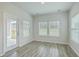 Bright sunroom featuring natural light from the large windows and access to the yard at 117 Oyster Tide Ave, Summerville, SC 29485