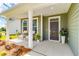 Inviting front porch with seating and vibrant landscaping, offering curb appeal at 119 Crosscut Ln, Summerville, SC 29486