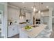 Modern kitchen featuring stainless steel appliances, a spacious island, and sleek countertops at 119 Crosscut Ln, Summerville, SC 29486