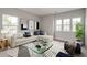 Bright living room with modern decor, large windows, and stylish accents at 119 Crosscut Ln, Summerville, SC 29486