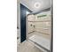 Bathroom featuring tiled shower with glass door, neutral walls, and decorative tile accents at 119 Scottswood Dr, North Charleston, SC 29418