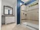 Well-kept bathroom features a glass-enclosed shower, a sink with marble countertop, and blue walls at 119 Scottswood Dr, North Charleston, SC 29418