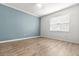 Well-lit, simple bedroom offers a neutral palette, hardwood floors, and lots of natural light at 119 Scottswood Dr, North Charleston, SC 29418