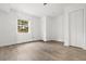 Bare bedroom with a window providing natural light, vinyl flooring, and two closets for ample storage at 119 Scottswood Dr, North Charleston, SC 29418