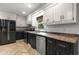 Modern kitchen features stainless steel appliances and white and black cabinets at 119 Scottswood Dr, North Charleston, SC 29418