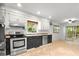Kitchen features stainless steel appliances and a sliding door to the backyard at 119 Scottswood Dr, North Charleston, SC 29418
