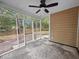 Screened porch with a view to the backyard and mature trees, providing a relaxing outdoor space at 119 Scottswood Dr, North Charleston, SC 29418