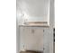 Enclosed wet bar featuring stone countertop and white cabinets at 119 Scottswood Dr, North Charleston, SC 29418