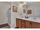 Bathroom with a double vanity, framed mirrors, and a glass-enclosed shower, creating a functional space at 127 Manning Ct, Summerville, SC 29485