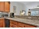 Open kitchen layout with granite countertops and view of the living area at 127 Manning Ct, Summerville, SC 29485