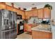 Well-equipped kitchen with stainless steel refrigerator and granite countertops at 127 Manning Ct, Summerville, SC 29485