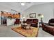 Spacious living room with high ceilings, carpet floors and elegant furnishings at 127 Manning Ct, Summerville, SC 29485