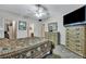 This main bedroom features a TV on a dresser, a mirror, and access to a bathroom and closet at 127 Manning Ct, Summerville, SC 29485
