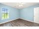 Well-lit bedroom with wood-look floors and natural light from a window at 129 Dovetail Cir, Summerville, SC 29483