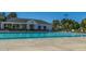 Large community pool with a covered seating area and lounge chairs, perfect for enjoying sunny days at 129 Dovetail Cir, Summerville, SC 29483