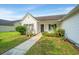 Cozy one-story home with a tidy front yard and a welcoming walkway to the front door at 129 Dovetail Cir, Summerville, SC 29483