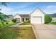 Inviting one-story home with a well-kept lawn and driveway leading to a single-car garage at 129 Dovetail Cir, Summerville, SC 29483
