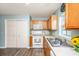 Efficient kitchen featuring wooden cabinets, white appliances, and a built-in microwave at 129 Dovetail Cir, Summerville, SC 29483