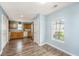 Inviting kitchen with wooden cabinets, a double-door refrigerator, and luxury vinyl plank flooring at 129 Dovetail Cir, Summerville, SC 29483