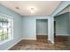 Bright living room with wood-look flooring and lots of natural light from the large window at 129 Dovetail Cir, Summerville, SC 29483