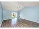 Bright living room with vaulted ceilings, modern ceiling fan, and sliding glass door access at 129 Dovetail Cir, Summerville, SC 29483