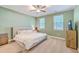 Cozy bedroom with natural light, ceiling fan, and soft carpeting at 1338 Addykay Pl, North Charleston, SC 29406