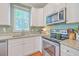 Well-equipped kitchen with stainless steel appliances and granite countertops, offering a functional cooking space at 1338 Addykay Pl, North Charleston, SC 29406