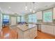 Bright, open kitchen and living area with granite countertops and stainless steel appliances at 1338 Addykay Pl, North Charleston, SC 29406