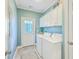 Well-lit laundry room with appliances, storage cabinets, and access to the exterior at 1338 Addykay Pl, North Charleston, SC 29406