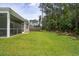 Expansive, lush backyard featuring a screened porch and wooded backdrop for outdoor enjoyment at 139 Sunray Ln, Summerville, SC 29486