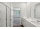 Bathroom with double sink vanity, walk-in shower, and view to a bedroom at 139 Sunray Ln, Summerville, SC 29486