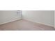 Cozy carpeted bedroom with white trim and a window providing natural light at 139 Sunray Ln, Summerville, SC 29486
