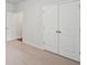Neutral bedroom featuring carpet, white trim, and a double door closet at 139 Sunray Ln, Summerville, SC 29486
