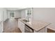 Kitchen island with stainless steel sink, granite countertops, and open to the living space at 139 Sunray Ln, Summerville, SC 29486