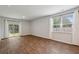 Spacious living room with wood flooring, windows, and sliding glass door at 139 Sunray Ln, Summerville, SC 29486