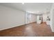Open-concept living area with wood floors, a kitchen island, and natural light at 139 Sunray Ln, Summerville, SC 29486