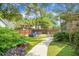Private backyard with a fire pit, seating area, and lush greenery, ideal for relaxation at 1422 Iroquois St, North Charleston, SC 29405