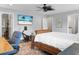 Spacious bedroom features a ceiling fan, rowing machine and an en suite bathroom at 1422 Iroquois St, North Charleston, SC 29405