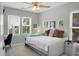 Bright bedroom features a daybed, desk and ample natural light from two windows at 1422 Iroquois St, North Charleston, SC 29405