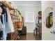 Walk-in closet with ample storage, wooden floor and a central window at 1422 Iroquois St, North Charleston, SC 29405
