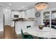 Bright dining area boasts a marble top table, modern chandelier, and access to the kitchen at 1422 Iroquois St, North Charleston, SC 29405