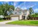 Charming two-story home featuring a brick-accented garage, beautiful lawn, and a manicured front yard at 1422 Iroquois St, North Charleston, SC 29405