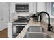 Kitchen with granite countertops, stainless steel appliances, updated sink, and white cabinetry at 1422 Iroquois St, North Charleston, SC 29405